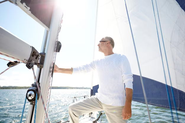 A man stands on the deck and looks away