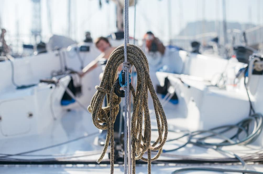 Close-up of a coiled rope on a sailboat deck