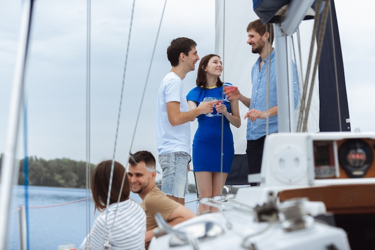 group of happy friends at boat