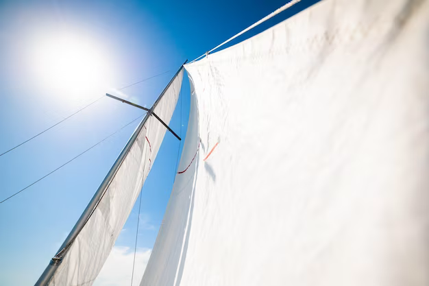 White sails against a blue sky