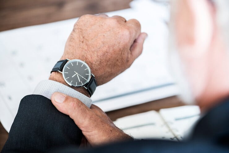 Man Checking Time on Handwatch